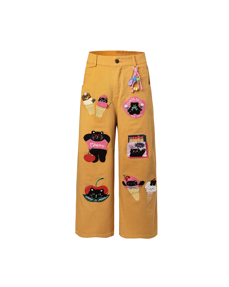 漫画の刺繍入りストレートレッグパンツ