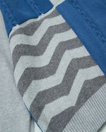 レトロなケーブルニットのイレギュラーセーター