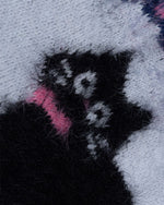 コントラストカラーのゆったりセーター