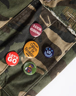 Washed ripped camouflage overalls