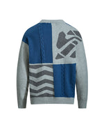 レトロなケーブルニットのイレギュラーセーター