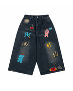 漫画の刺繍が入ったデニムショートパンツ